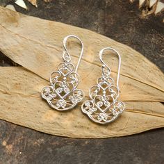 Add some exotic flare to your look with our stunning Sterling Silver Dangly Indian Hearts Earrings These beautifully stylish sterling silver drop earrings are sure to become a jewellery box favourite Their design features an intricate filigree pattern which uses a heart as its central influence. The detailing and gentle icing sugar finish make these earrings look as if they are made from delicate lace. You can also see the influence of India, renowned for it's exquisite fabrics and textiles, in these earrings patterning. All of our jewellery comes complete with a gift box and blank gift card for you to write a short message on Made from: Sterling silver Dimensions: 3.1cm x 1.6cm Sterling Silver Hallmarked Chandelier Earrings, Hallmarked Sterling Silver Chandelier Earrings, Ornate Sterling Silver Earrings With Elegant Design, Sterling Silver Filigree Chandelier Earrings As Gift, Filigree Sterling Silver Chandelier Earrings For Gift, Sterling Silver Chandelier Earrings With Intricate Design For Gift, Sterling Silver Chandelier Earrings With Intricate Design, Silver Filigree Chandelier Earrings For Anniversary, Fabrics And Textiles