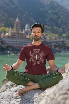 Here's our newest fun tshirt design: A Cozy Yoga Festival Shirt with the Moon Phases. Perfect for maditative souls!  The Sri Yantra holds great significance. It symbolizes the union of masculine and feminine divine energies. The triangles, varying in size, form 43 smaller triangles in concentric levels, mirroring the cosmos. And yes we added the moon phases for the astral and spiritual voyager.  If you like this shirt... Don't wait, just get it before we decide to stop listing this one!  ### How Cotton Relaxed Fit Top For Meditation, Crew Neck Cotton Shirt For Festivals, Relaxed Fit Graphic Print Tops For Meditation, Graphic Print Short Sleeve Tops For Festivals, Graphic Print Short Sleeve Tops For Yoga, Casual Screen Print Tops For Festivals, Festival Crew Neck Tops, Festival Graphic Tee With Screen Print, Graphic Tee Tops For Festivals With Short Sleeves