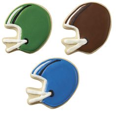 three football helmets are shown in four different colors, one is brown, one is green