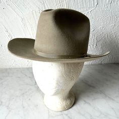 Bailey grey felt cowboy hat is in excellent condition with normal wear. Grey wool felt western rancher hat with ribbon hat band. Size 6-1/2. Brim measures 3"; crown 5-1/8". Interior measures 20-1/2". Felt Cowboy Hats, Rancher Hat, Chapeau Cowboy, Western Cowboy Hats, Hat Band, Cowboy Hat, Western Cowboy, Vintage Finds, Wool Felt