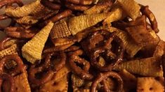 cheetos and pretzels are mixed together in a bowl