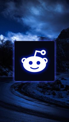 a blue square with a smiley face on it in the middle of a night sky