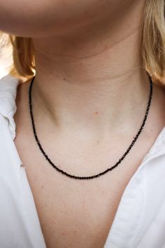 Drama calls and this Black Spinel necklace answers. Black Spinel is actually rarer than black diamonds and unlike black diamonds, is naturally this deep black color. Black is the rarest of the colors that occur in spinel family and is usually mined alongside rubies and sapphires. 17 inch length Metal/Materials: . Black Spinel beads, beading cable, gold crimps, gold French wire, gold-filled lobster clasp, crimp covers and jump rings. (sterling silver lobster clasp option) Elegant Black Spinel Jewelry With Faceted Beads, Elegant Black Spinel Beaded Necklace, Black Spinel Gemstone Necklace For Gift, Black Gemstone Necklaces With Round Beads, Fine Jewelry Black Diamond Necklaces, Black Faceted Round Necklace, Black Spinel Round Beads Jewelry For Gifts, Elegant Black Rondelle Beaded Necklaces, Gift Black Spinel Round Bead Jewelry