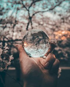 a person holding a crystal ball in their hand with the words new perspective on it