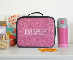 "Personalized Kid's Lunch Box -Our Personalized Kids Insulated Lunch Box is the ideal choice for parents who want to provide their children with a delightful lunchtime experience. With its unique design, practical features, and customization options, it's sure to become your child's favorite lunchtime accessory! Make lunchtime extra special and unforgettable for your little one with our Personalized Kids Insulated Lunch Box. ⚙️ Product Specification Material: Polyester/Clear PVC Size: 9-1/2\" X 7-1/2\" X 3 Insualted ✅ Ordering & Processing We make it our mission to process our orders fast and efficiently! You will be asked if you would like a proof upon adding your product to the cart. If you select No we will begin the production process right away for you! If you choose Yes on the proof, Playful Pink Lunch Box For Gift, Playful Pink Lunch Box Gift, Pink Lunch Box For Back To School Gift, Pink Craft Supplies For End Of School Year Gift, Pink Stationery Gift For Back To School, Pink Stationery For Back To School Gift, Personalized Rectangular Lunch Box Gift, Back To School Pink Craft Supplies Gift, Pink Craft Supplies For Back To School Gift