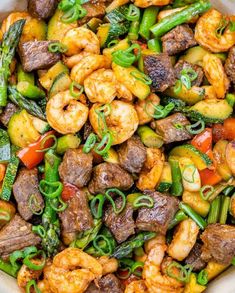 stir fry with shrimp and vegetables in a white bowl