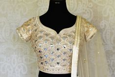 Shop Online Off White Lucknowi Lehenga with Silk Blouse and Net Dupatta Cream Bollywood Lehenga In Chinon, Designer White Dola Silk Choli, White Kundan Lehenga With Cutdana, Bollywood Style Cream Choli With Pallu, White Chinon Lehenga For Reception, Cream Resham Embroidery Choli For Saree, Designer Cream Choli With Cutdana Details, Cream Choli With Zari Work For Diwali, Off White Bollywood Choli With Cutdana