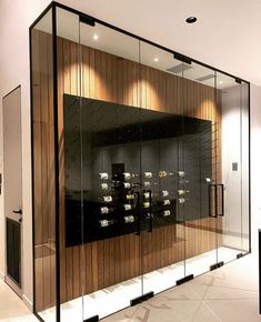 the inside of a wine cellar with glass walls