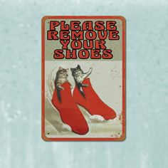 a sign that says please remove your shoes with two cats in red shoes on it