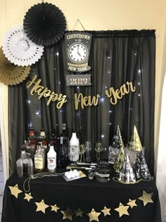 a new year's eve party with black and gold decorations