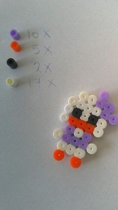 the beads are made to look like sheeps with numbers on them and one has an orange nose