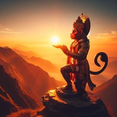 an image of a statue on top of a mountain with the sun in the background