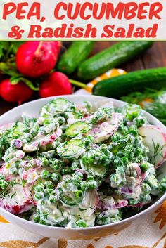 a bowl filled with cucumber and radish salad on top of a table