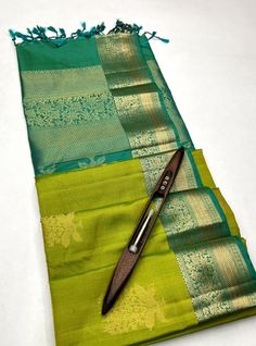 Mughizh - Apple Green & Aqua Green (Kanchi Border) Bhutta Handloom Soft Silk Saree The Mughizh saree, with its Apple Green and Aqua Green hues, adorned with a Kanchi border and intricate Bhutta designs, exemplifies elegance and tradition. Crafted with the finest handloom soft silk, it promises both comfort and style, making it a perfect choice for any festive occasion. Features Color: Apple Green & Aqua Green Design: Kanchi Border with Bhutta motifs Fabric: Soft Silk Occasion: Festive, Traditional Specifications Length: 6.3 meters (with blouse piece) Width: 1.1 meters Weight: Approximately 750 grams Weave Type: Handloom Material & Care Material: 100% Pure Soft Silk Care: Dry clean only to maintain the texture and color Storage: Store in a cool, dry place, preferably wrapped in a muslin clo Semi-stitched Chanderi Saree With Tilla Detailing, Semi-stitched Chanderi Saree With Tilla, Chanderi Saree Semi-stitched With Tilla, Green Semi-stitched Traditional Wear With Tilla, Green Wedding Saree With Tilla Work, Green Wedding Saree With Tilla Details, Semi-stitched Tilla Saree For Diwali, Diwali Pre-draped Saree With Tilla For Puja, Festive Tissue Silk Traditional Wear With Tilla