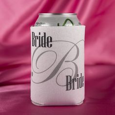 a white can cooler with the word bride on it sitting in front of a pink background