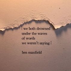 a torn piece of paper with the words we both drown under the waves of words