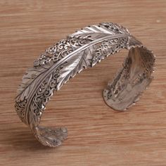 Flawless leaves and fantastic openwork spiral motifs are handcrafted in sterling silver circling the wrist with an effortless elegance. Designed by Dewa Arimbawa this cuff bracelet showcases Balinese artistry making an excellent companion with a variety of styles and tastes. Silver Bracelet Stack, Galaxy Jewelry, Bracelets Silver, Leaf Motif, Jewellery Ideas, Sterling Silver Cuff Bracelet, Moon Jewelry, Functional Accessories, Silver Accessories