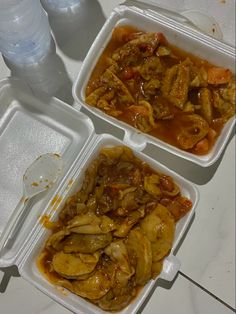 three plastic containers filled with food on top of a table