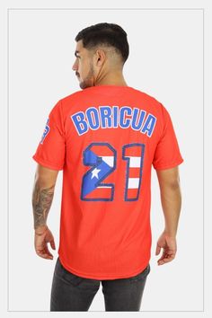 a man wearing an orange shirt with the number twenty on it and blue lettering that reads boricua