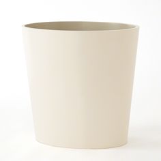 a white cup sitting on top of a table