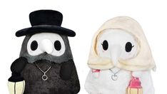 two stuffed animals wearing hats and scarves, one with a penguin on it's back