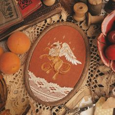 a table topped with oranges and other items