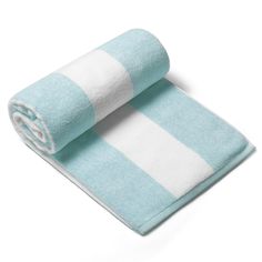 two towels folded on top of each other in blue and white striped pattern, one rolled up to the side