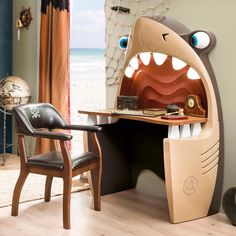 a room with a desk and chair made to look like a monster's mouth