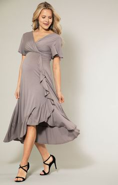 Looking for something extra chic during pregnancy? You've found it! Introducing our Waterfall Dress in warm dusky taupe grey that ticks all the boxes. Discover instant comfort, style and confidence in one dress - you won't want to take it off, and that's okay, it's great for nursing too. Warm dusky taupe grey shade in premium jersey Ruffles on front/side and hem of skirt Cross-over neckline (front & back) Bell shaped sleeves Pull-on-overhead Breastfeeding friendly Made in Britain Rose Tiffany, Maternity Dress Wedding Guest, Floral Dress Wedding Guest, Waterfall Dress, Cute Maternity Dresses, Maternity Wrap Dress, Maternity Wedding, Formal Maternity Dress, Tiffany Rose