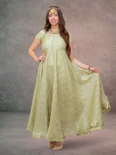 Step into a fairy tale with the Enchanting Anarkali Pastel Green Dress, elegantly crafted from organza and embellished with gold flower work. This full-length, flared dress is perfect for festive and formal occasions, offering a look of ethereal beauty. It is recommended that this item be dry cleaned for optimum preservation. Key Specifications : Material Organza Occasion Festive Type Anarkali Dress Eid Festive Dresses With Gold Embroidery, Festive Gold Embroidered Dress For Eid, Traditional Organza Dress With Pallu, Festive Art Silk Dress With Sheer Dupatta, Semi-stitched Dresses With Gold Embroidery For Diwali, Gold Embroidered Saree Dress For Party, Chanderi Dress For Reception And Eid, Tissue Silk Dress For Eid Reception, Eid Dress With Gold Embroidery In Traditional Drape