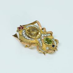 dsfantiquejewelry-perugini-gold-brooch Unique Gold Gemstones For Wedding, Fine Jewelry Gold Brooches With Multi-stone, Fine Jewelry Multi-stone Yellow Gold Brooches, Gold Multi-stone Fine Jewelry Brooches, Fine Jewelry Yellow Gold Multi-stone Brooches, Unique Yellow Gold Brooches With Gemstone, Yellow Gold Multi-stone Brooches As Gift, Heirloom Yellow Gold Gemstone Brooches, Unique Diamond Wedding Brooches