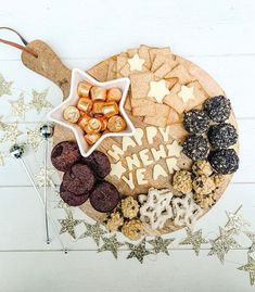 a platter filled with cookies and crackers