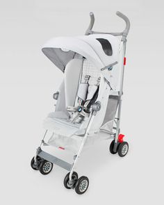 a baby stroller with wheels and an umbrella on it's back end, in white