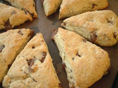 several scones are arranged in a circle on a baking sheet