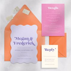 an orange and pink wedding suite with matching envelopes, rsp card and note