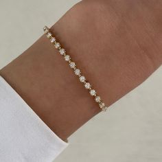 This bracelet features 16 round diamonds on a beautiful dainty paper clip style chain. 14K Yellow Gold Length: 6" + 1" 0.41ct 2.18 grams Aesthetic Jewellery, Dainty Bracelets, Mixed Metals, Arm Candy, Personalized Necklace, Paper Clip, Diamond Studs, Shop Necklaces, Round Diamond