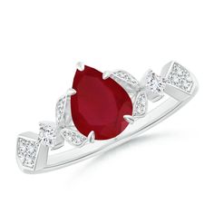 a white gold ring with an oval ruby stone and diamond accents