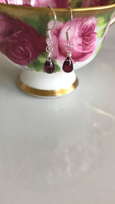 Some more of the raspberry purple coloured Rhodolite Garnets. Just love this colour of garnets. The length of these earrings are 1 1/4 inch. The garnets themselves measure approximately 6 mm in length. Finished with sterling silver material. ABOUT SHIPPING- Shipping within Canada is crazy expensive. If there is any overage I will refund. I'm very limited in adding different cost of shipping between provinces.  I have tried different ways of listing shipping costs and this is the only way I can d Sterling Silver Briolette Earrings For Gift, Purple Garnet Jewelry Gift, Silver Briolette Earrings With Birthstone, Nickel Free Garnet Earrings Gift, Garnet Gemstone Earrings As A Gift, Garnet Birthstone Drop Earrings, Silver Ruby Earrings With Birthstone, Silver Garnet Drop Earrings, Silver Garnet Birthstone Earrings