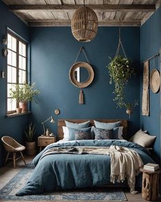 a bedroom with blue walls and wooden beams