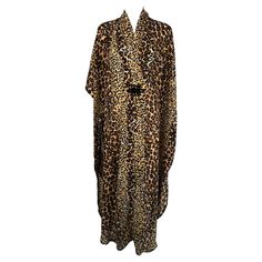 1960s Leopard pint crepe caftan robe by Marjorie Ellin Inc. Perfect for the pool or beach or entertaining at home. This caftan wraps at the front with a hidden Velcro closure and a decorative black fabric frog at the front. There is a single large open patch pocket at the front right hip. The caftan has shirt tail hems at each side. Unlined. Marked OSFA. In excellent wearable condition. All our clothing is dry cleaned and inspected for condition and is ready to wear. Any condition issues will be Black Fabric, Shoulder Sleeve, Patch Pocket, 1960s, Ready To Wear, Lounge Wear, Lingerie, Pool, Fashion Outfits