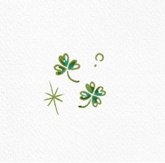 two green clovers with question marks in the middle on a white paper background photo