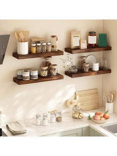 three wooden shelves above a kitchen sink filled with spices and condiments on the wall