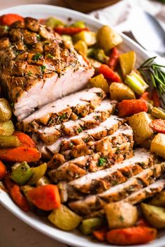 a white plate topped with meat and veggies