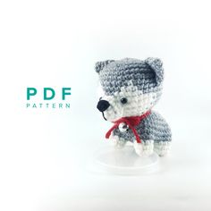 a crocheted stuffed animal sitting on top of a plastic plate with the words pdf written below it