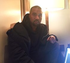 a man sitting in front of a laptop computer