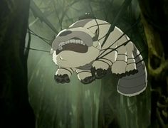 an animated image of a creature in the woods with its mouth open and eyes wide open