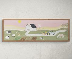 a painting hanging on the side of a wall next to a white wall with a barn and farm animals