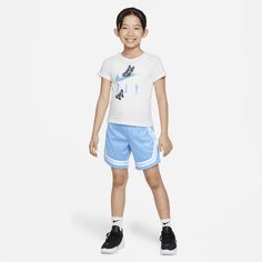 This 2-piece set is an easy way to dress kiddos who like to fly around on the playground. The cotton jersey knit tee has a classic cut and a tagless crewneck for an easy feel. The matching shorts are made of pique knit fabric, feature a crossover pattern and are enhanced with quick-drying, moisture-wicking Dri-FIT technology to help keep them cool and dry at play. Nike Sets With Graphic Print And Crew Neck, Nike Crew Neck Sets With Graphic Print, Nike Graphic Print Crew Neck Sets, Sporty T-shirt For Playwear In Spring, Sporty T-shirt For Spring Playwear, Sporty Spring T-shirt For Playwear, Playful Nike Tops For Playtime, Nike Playful Tops, Nike Sporty T-shirt For Play