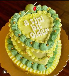 a heart shaped cake with the words happy birthday on it