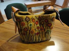 a purse sitting on top of a wooden table